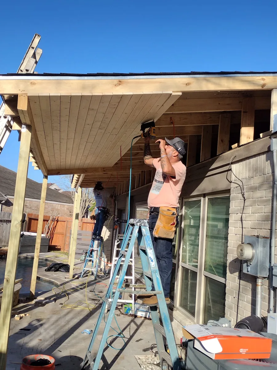 Framing the roof of a patio cover on the job