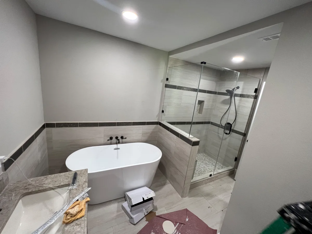 Remodeled bathroom with a freestanding tub and a tiled walk-in shower