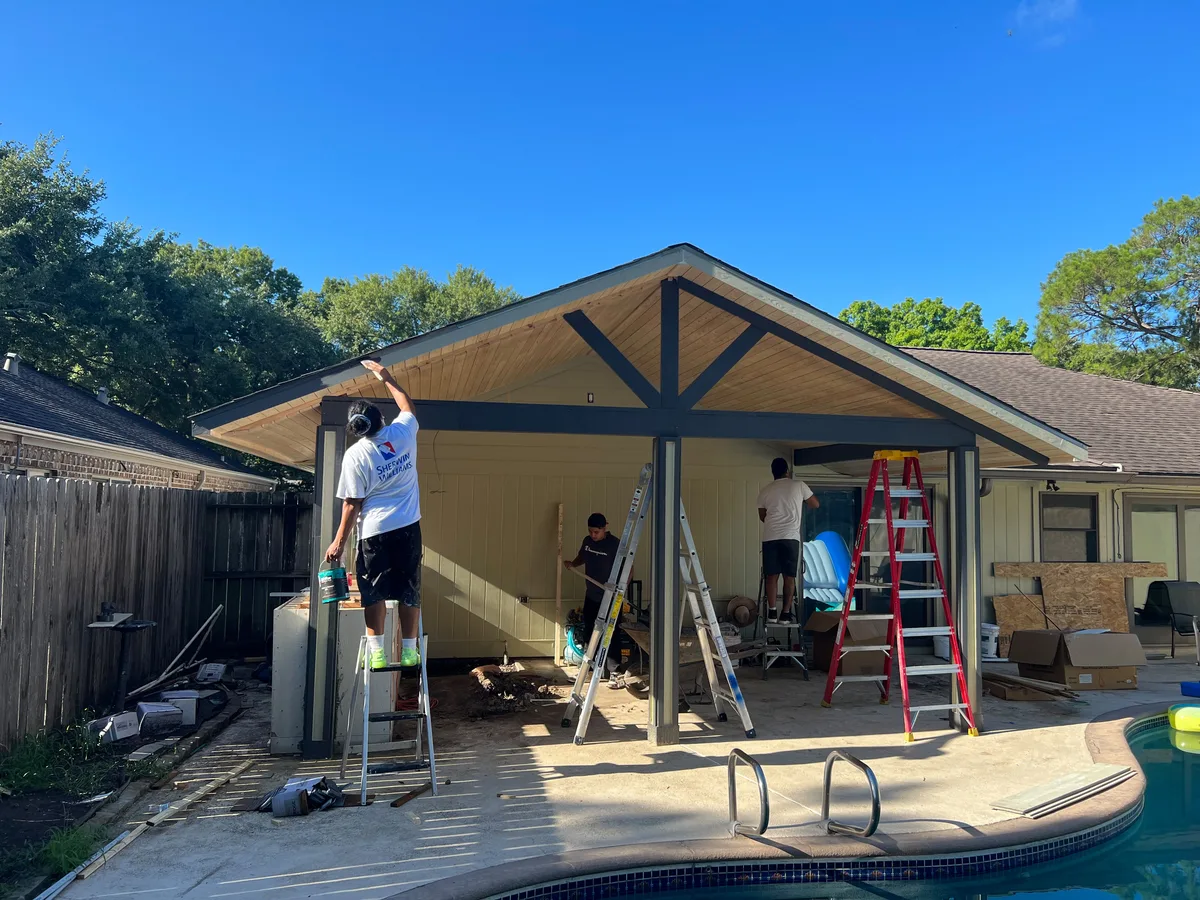 Patio cover being framed and roofed