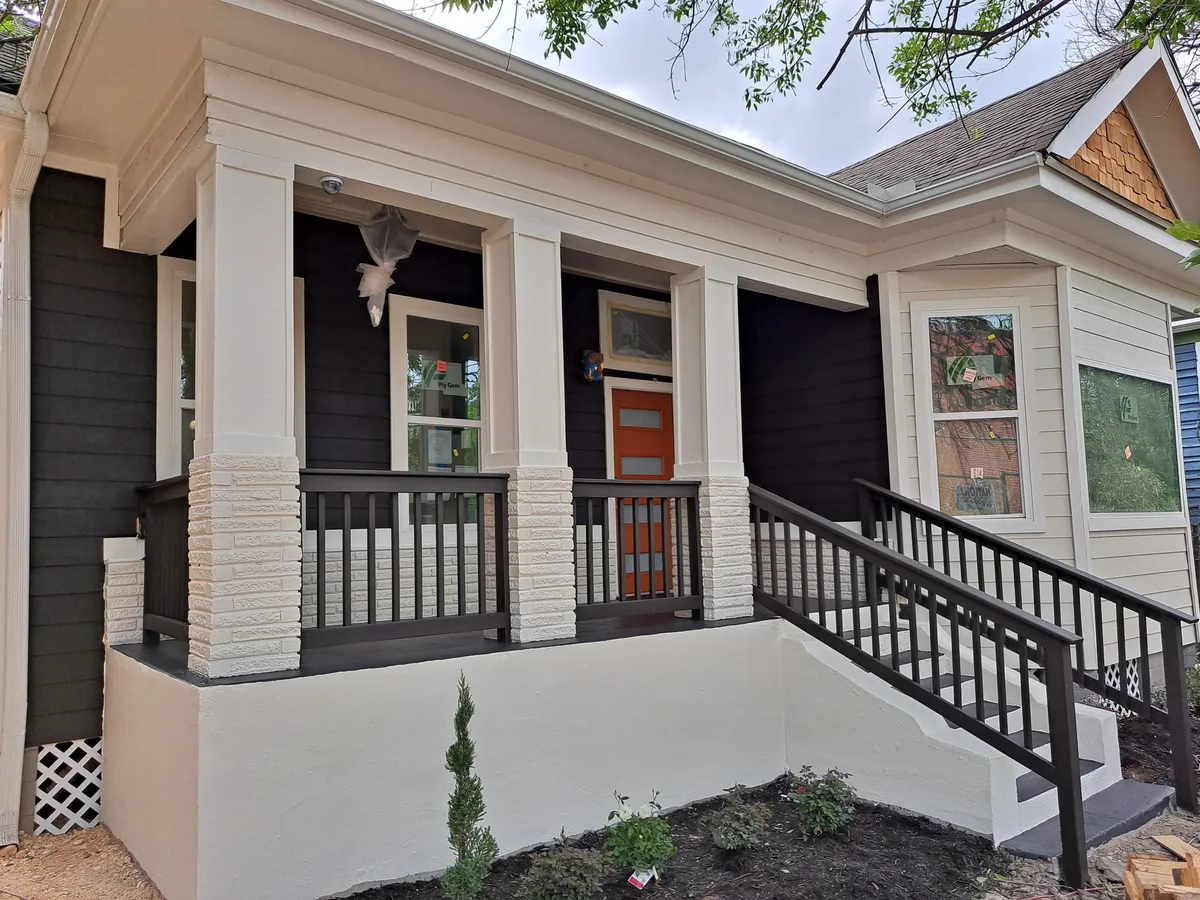 Remodeled front porch with new railings and columns